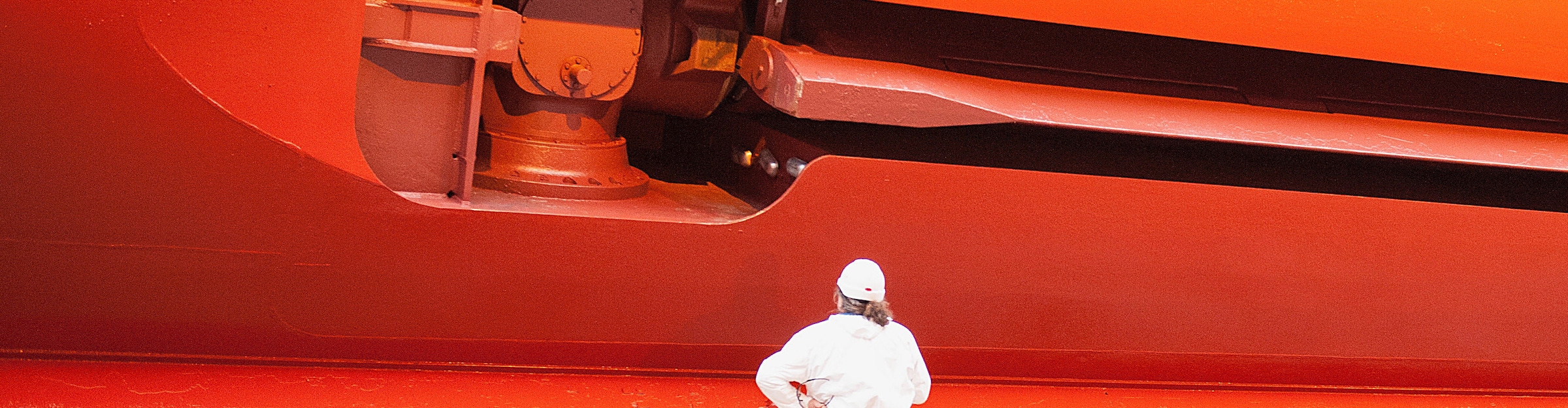 Close-up of worker looking at side of the Norwegian Star